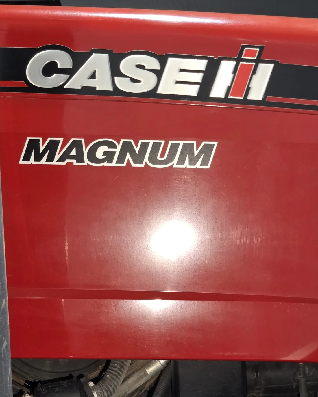 Before decal-area paint correction on Case IH Magnum 275
