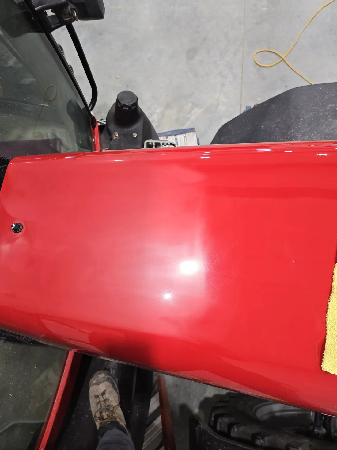 Half-polished hood showing correction progress